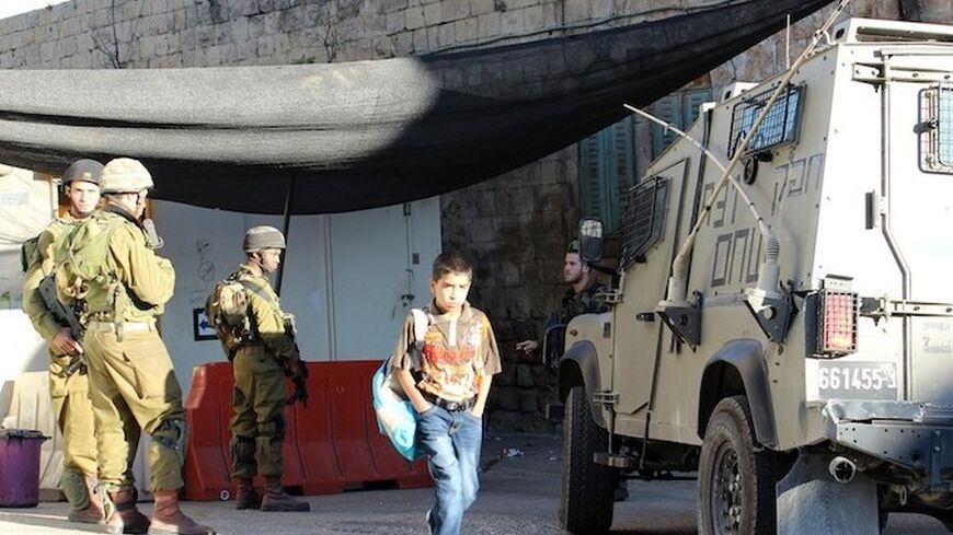 1-boy walks through checkpoint.jpg