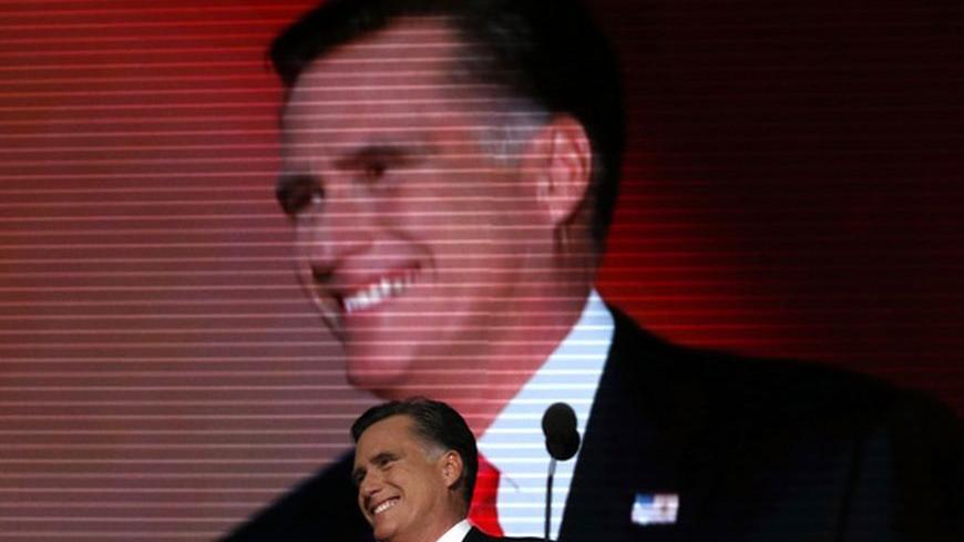 Republican presidential nominee Mitt Romney smiles as he arrives onstage to accept the nomination during the final session of the Republican National Convention in Tampa, Florida, August 30, 2012. REUTERS/Adrees Latif (UNITED STATES - Tags: ELECTIONS POLITICS)