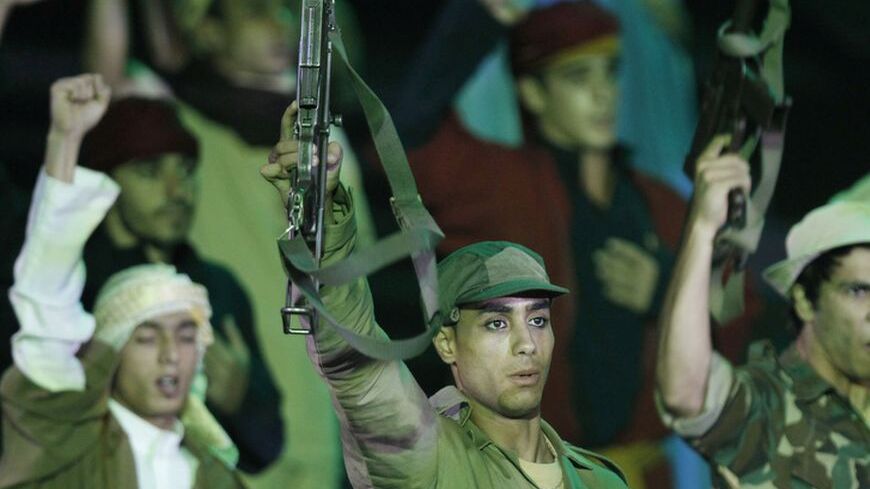Algerian actors reenact the Algerian war against France during the celebration of the 50th anniversary of their independence from France, which occupied Algeria for 132 years, in Algiers July 5, 2012. REUTERS/Louafi Larbi (ALGERIA - Tags: ANNIVERSARY ENTERTAINMENT SOCIETY)