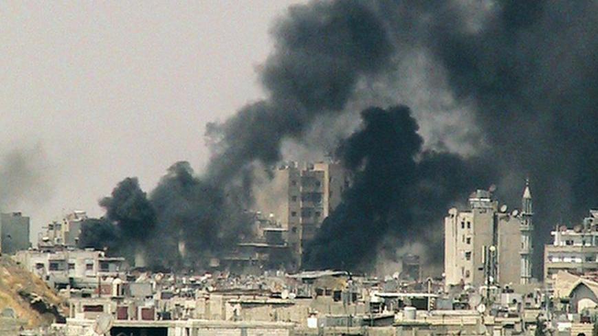 Smoke rises from Juret al-Shayah in Homs July 22, 2012. Picture taken July 22, 2012. REUTERS/Shaam News Network/Handout (SYRIA - Tags: POLITICS CIVIL UNREST) FOR EDITORIAL USE ONLY. NOT FOR SALE FOR MARKETING OR ADVERTISING CAMPAIGNS