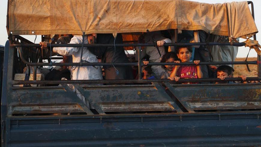 Fleeing civilians arrive at an unofficial border crossing with Turkey in the northern Syrian province of Idlib August 6, 2012. Hundreds of Syrian refugees arrived at the unofficial border crossing with Turkey, fleeing an escalating military campaign by Syrian troops to recapture rebel strongholds in the northern city of Aleppo. REUTERS/Zohra Bensemra (SYRIA - Tags: POLITICS CONFLICT CIVIL UNREST)