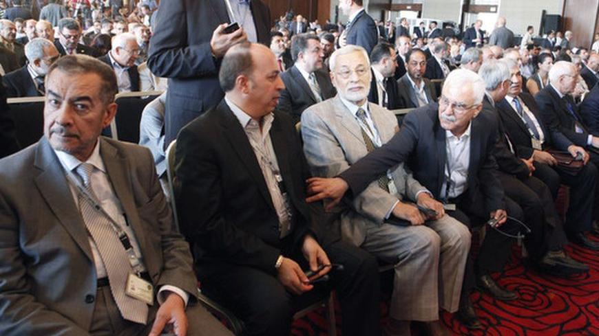 Members of Syria's opposition attend a Syrian opposition conference in Cairo July 2, 2012. Members of Syria's opposition and Arab and other foreign ministers begin a two-day conference in Cairo. REUTERS/Asmaa Waguih (EGYPT - Tags: POLITICS CIVIL UNREST)