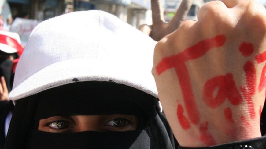 A Yemeni women wears a lock around her wrist with the name Taiz painted in red on her hand, during a demonstration in Taiz, south of the capital Sanaa on December 5, 2011. Forces loyal to Yemeni President Ali Abdullah Saleh shot dead a woman and wounded six other people when they opened fire on a crowd of protesters, medics said.
AFP PHOTO/STR (Photo credit should read -/AFP/Getty Images)