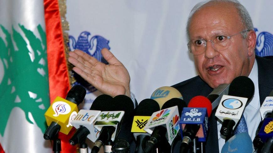 Lebanese Information Minister Michel Samaha answers a question at a joint news conference with his Syrian counterpart Ahmad al-Hasan in Damascus. Sept 12, 2004. The two officials denied reports heralding a Syrian troop deployment following a United Nations Security Council resolution demanding that foreign troops quit Lebanon.REUTERS/ Khaled al-Hariri