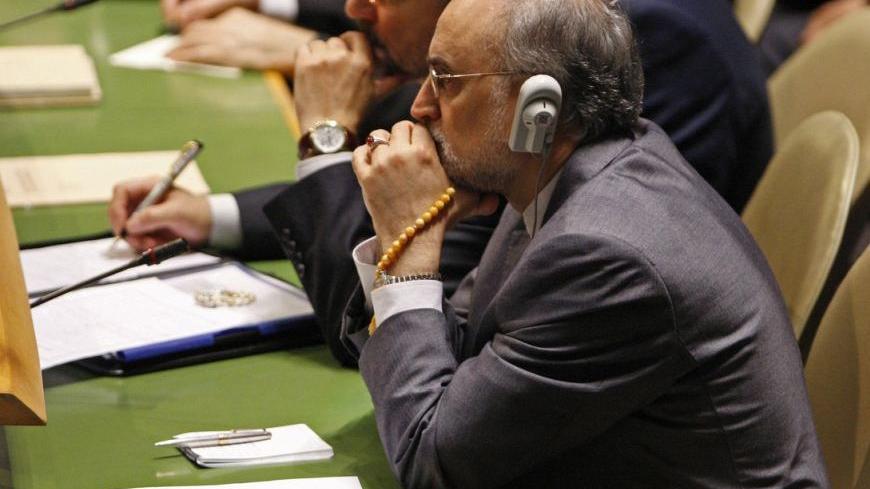 Iran's Foreign Minister Ali Akhbar Salehi listens to U.S. President Barack Obama as he addresses the 66th United Nations General Assembly at the U.N. headquarters in New York, September 21, 2011. REUTERS/Jessica Rinaldi (UNITED STATES - Tags: POLITICS)