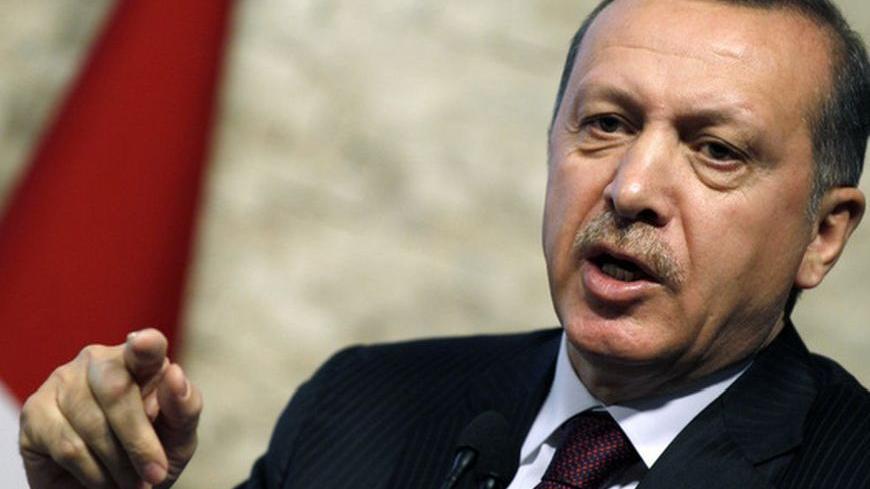Turkey's Prime Minister Recep Tayyip Erdogan addresses the media in Ankara April 5, 2012. Erdogan announced on Thursday a new incentive scheme aimed at reducing Turkey's gaping current account deficit by encouraging local production of some previously imported goods. The new scheme will include tax cuts, VAT exceptions and will reduce interest on strategic and regional investments, Erdogan said at a news conference. REUTERS/Umit Bektas (TURKEY - Tags: POLITICS BUSINESS)