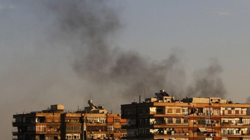 Smokes rises from the Qaboun area during clashes between the Syrian Free Army and Syrian army forces in Damascus October 10, 2012. REUTERS/Omar Khani      (SYRIA - Tags: CIVIL UNREST POLITICS)