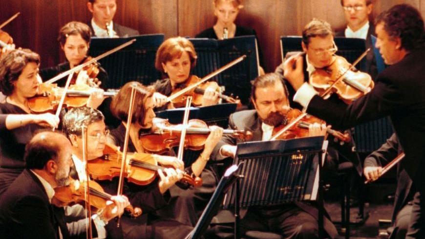 Italian Conductor Umberto Benedetti Michel Angeli conducts the Lebanese National Symphony Orchestra during a concert at the al-Bustan Festival in Beit-Mery near Beirut on February 20, 2001. Michel Angeli treated the opening night crowd to a selection of time-honoured classics including Vivaldi's Four Seasons and a little bit of Mozart.

JS