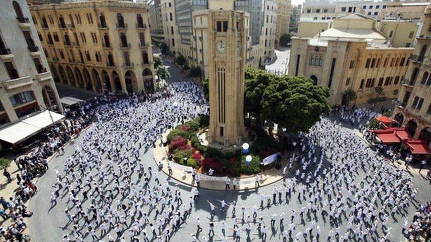 Lebanese students dance during "The Big Dance" event in downtown Beirut, near the parliament May 18, 2012. "The Big Dance" is an initiative of the British Council's global project "Connecting Classrooms" which aims to develop links between schools in Britain and Lebanon. REUTERS/Sharif Karim (LEBANON - Tags: SOCIETY EDUCATION)