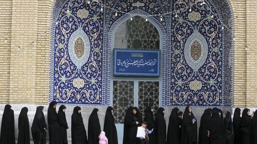 EDITORS' NOTE: Reuters and other foreign media are subject to Iranian restrictions on leaving the office to report, film or take pictures in Tehran.

Women stand in line to cast their votes during the parliamentary election, in the court yard of the holy shrine in Qom, 120 km (75 miles) south of Tehran March 2, 2012. Iranians voted on Friday in a parliamentary election which is expected to reinforce the power of the clerical establishment of Supreme Leader Ayatollah Ali Khamenei over hardline political ri