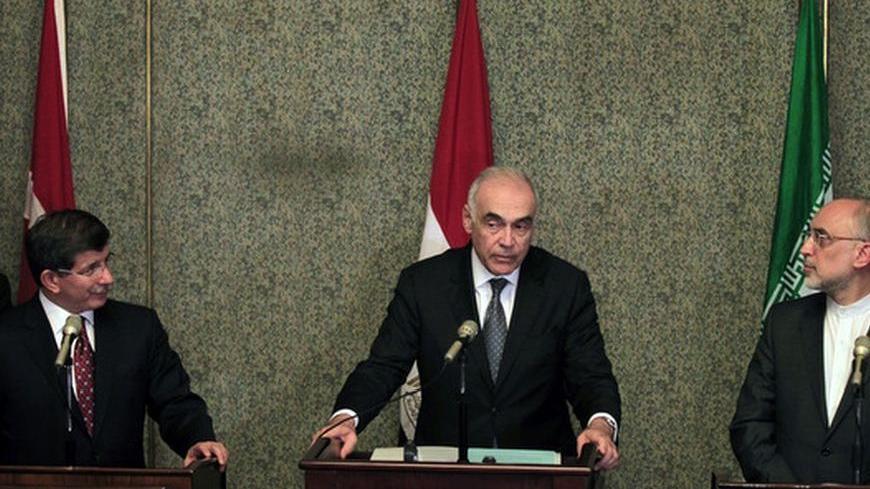 Turkish Foreign Minister Ahmet Davutoglu (L), Egyptian Foreign Minister Mohamed Kamel Amr (C) and Iranian Foreign Minister Ali Akbar Salehi attend a news conference after a meeting regarding the Syrian crisis, in Cairo September 17, 2012. Saudi Arabia stayed away from a meeting on the Syria crisis convened by regional powers on Monday, setting back a forum grouping Iran - President Bashar al-Assad's main Middle East ally - and his leading opponents in the region. The "contact group" of Egypt, Iran, Turkey a