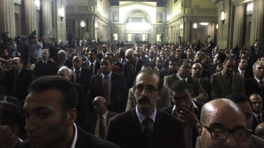 Judges attend a meeting at Egypt's Judges Club in Cairo November 24, 2012. Egyptian President Mohamed Mursi faced a rebellion on Saturday from judges who accused him of expanding his powers at their expense, deepening a crisis that triggered calls for more protests following a day of violence across Egypt. REUTERS/Asmaa Waguih (EGYPT - Tags: POLITICS)