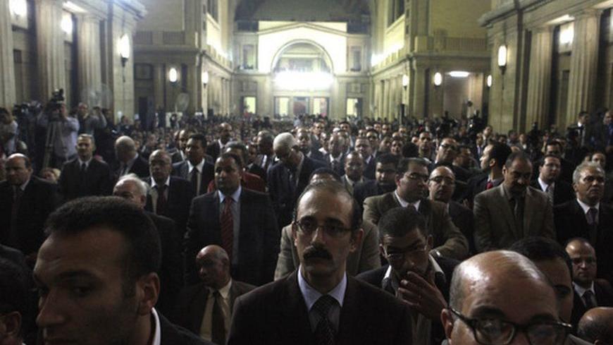 Judges attend a meeting at Egypt's Judges Club in Cairo November 24, 2012. Egyptian President Mohamed Mursi faced a rebellion on Saturday from judges who accused him of expanding his powers at their expense, deepening a crisis that triggered calls for more protests following a day of violence across Egypt. REUTERS/Asmaa Waguih (EGYPT - Tags: POLITICS)