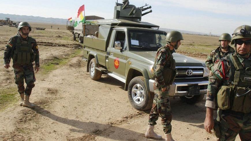 Kurdish Peshmerga troops are deployed on the outskirts of Kirkuk, some 250km (155 miles) north of Baghdad December 3, 2012. Iraq's Kurdish region has sent reinforcements to a disputed area where its troops are involved in a standoff with the Iraqi army, a senior Kurdish military official said, despite calls on both sides for dialogue to calm the situation. Picture taken December 3, 2012. REUTERS/Ako Rasheed (IRAQ - Tags: POLITICS MILITARY CIVIL UNREST)