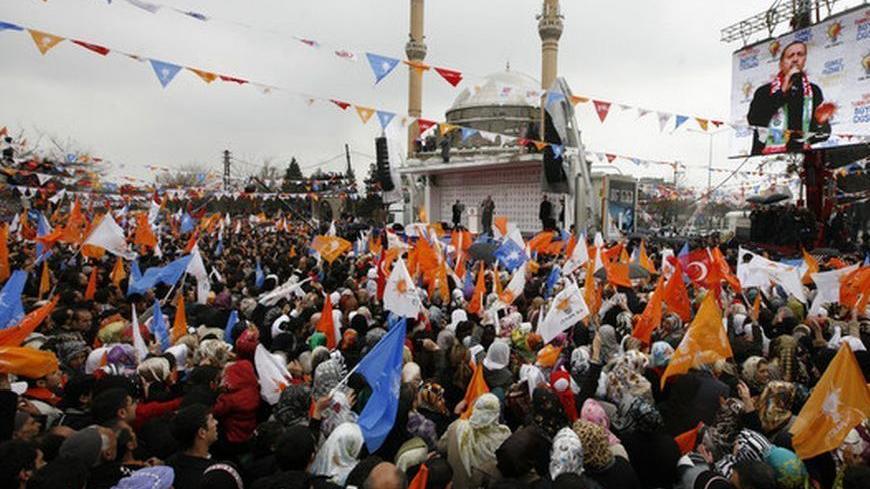 Turkey's Prime Minister Tayyip Erdogan delivers a speech as he campaigns ahead of the March 29 local elections in southeastern city of Diyarbakir February 21, 2009. Diyarbakir, the biggest city of Turkey's impoverished Kurdish southeast, is a battleground in local elections seen as a referendum on Erdogan's AK Party. The AK Party is seeking to gain fresh legitimacy after it narrowly escaped a legal attempt by its secularist opponents to ban it for Islamist activities in 2008. REUTERS/Osman Orsal (TURKEY)