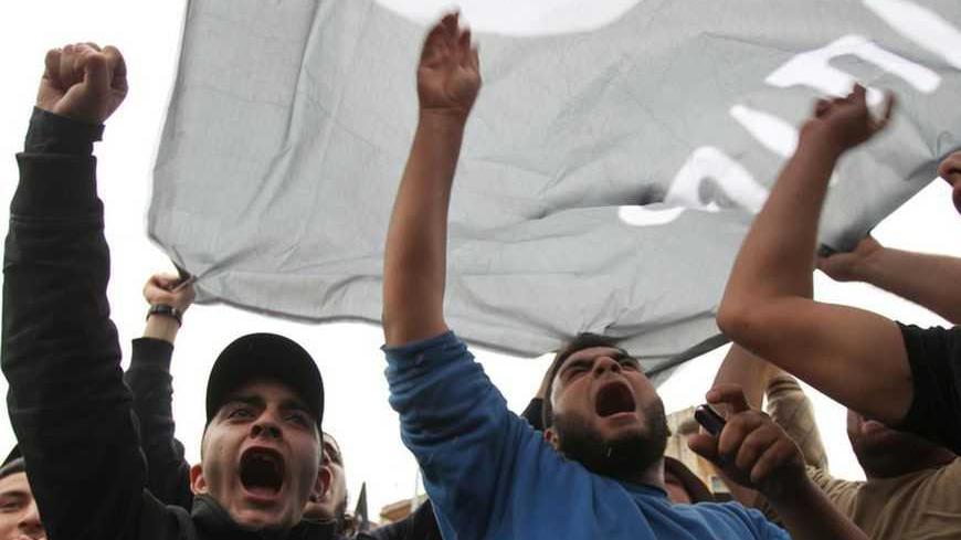 Relatives of Lebanese who had gone missing in Syria on Friday chant slogans during a protest to enquire about their relatives' fate, in Tripoli, northern Lebanon, December 3, 2012. At least 12 Lebanese gunmen were killed in a Syrian army ambush in the central Syrian province of Homs, a security source and people close the men's families said on Friday, a sign that Lebanon is getting further tangled in Syria's war. The Syrian Observatory for Human Rights said 30 Lebanese fighters had gone missing and a secon