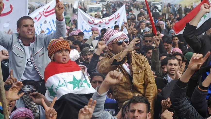 Protesters take part in a demonstration in Ramadi, 100 km (62 miles) west of Baghdad, January 9, 2013. Opponents of Iraqi Prime Minister Nuri al-Maliki said on Wednesday they would call him to parliament for questioning in a second attempt to force a vote of no confidence as the Shi'ite leader faces Sunni Muslim protests. REUTERS/Ali al-Mashhadani (IRAQ - Tags: CIVIL UNREST POLITICS)