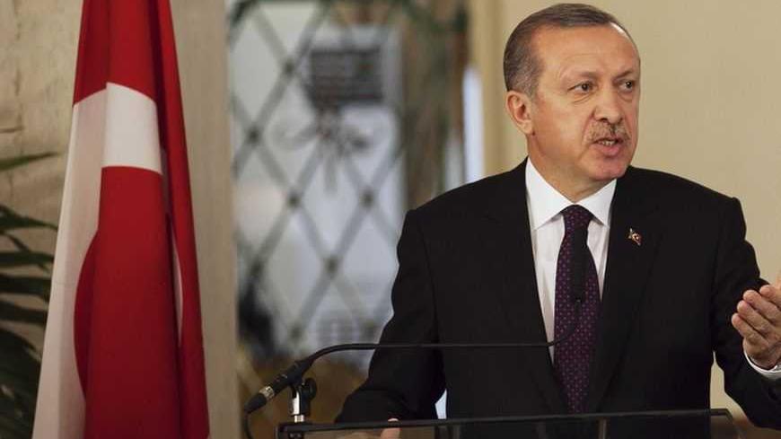 Turkey's Prime Minister Tayyip Erdogan speaks to the media during a meeting with Senegal's President Macky Sall at the presidential palace in Dakar January 10, 2013.   REUTERS/Joe Penney    (SENEGAL - Tags: POLITICS) - RTR3CA64