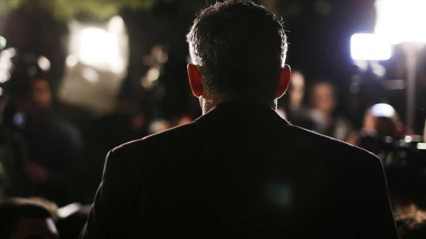 Yair Lapid, leader of the Yesh Atid (There's a Future) party, speaks to members of the media outside his home in Tel Aviv January 23, 2013. Lapid, a former television news anchor whose new centrist party stormed to second place in Israel's election, may well be the kingmaker holding the keys to the next coalition government. REUTERS/Amir Cohen (ISRAEL - Tags: POLITICS ELECTIONS) - RTR3CUU2