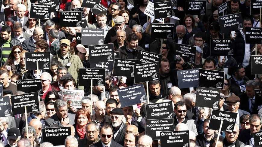 Journalists and activists participate in a rally calling for press freedom in central Ankara March 19, 2011. The recent arrest and jailing of some 10 journalists as part of investigations into Ergenekon, an ultra-nationalist, secularist network opposed to Prime Minister's Tayyip Erdogan's rule, has a triggered expressions of concern from the European Union, the U.S. and human rights groups about Ankara's commitment to media freedom and democratic principles. REUTERS/Umit Bektas (TURKEY - Tags: CIVIL UNREST 