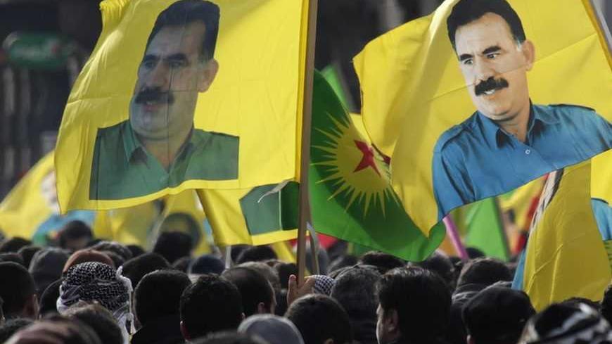 Demonstrators hold flags with portraits of jailed Kurdistan Workers Party (PKK) leader Abdullah Ocalan during a protest in Strasbourg February 18, 2012. Thousands of demonstrators protested in support of Ocalan, who was captured on February 15, 1999, and is currently serving a life sentence in Turkey. REUTERS/Vincent Kessler (FRANCE  - Tags: POLITICS CIVIL UNREST)
