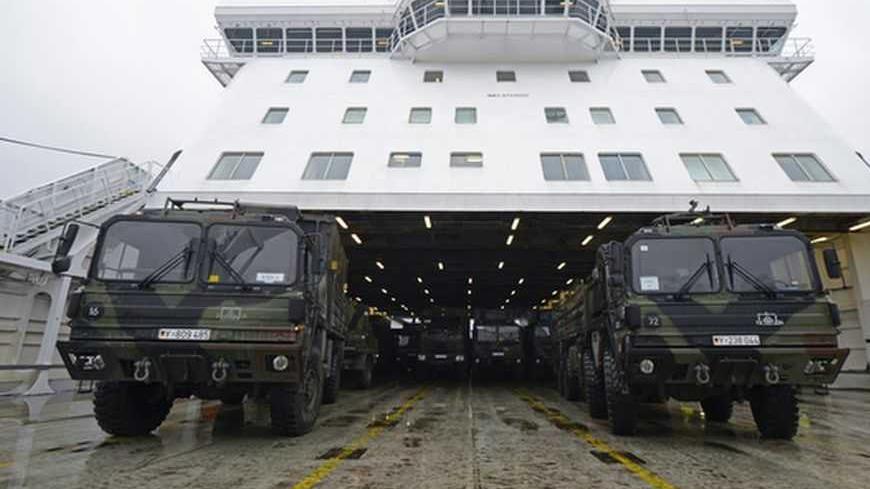 Military vehicles of a Patriot missile system are loaded on a ship in the harbour of Travemuende, January 8, 2013. Germany, the Netherlands, and the United States are each sending two Patriot missile batteries and up to 400 troops to Turkey after Ankara asked for NATO's help to bolster security along its 900-km (560-mile) border with Syria. REUTERS/Fabian Bimmer (GERMANY - Tags: MILITARY)