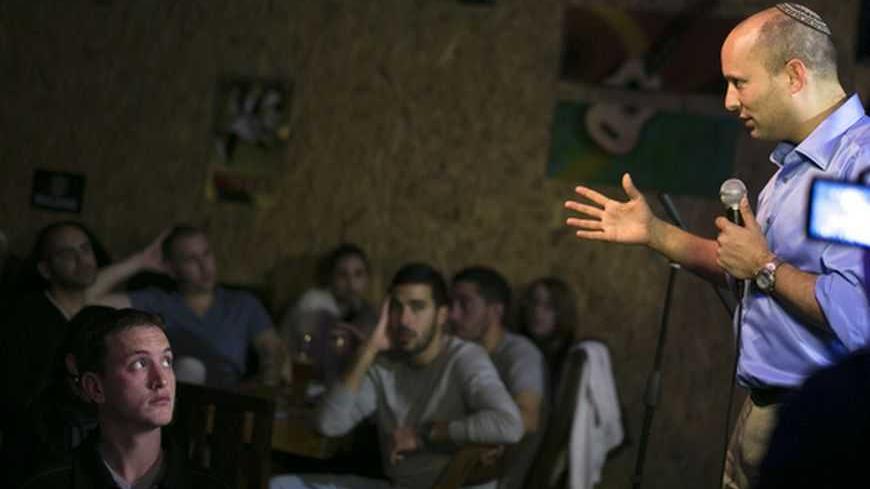 Naftali Bennett, head of the Beit Yehudi (Jewish Home) party, campaigns at a bar in the southern city of Ashdod December 27, 2012. A Palestinian state would be suicide for Israel, says Bennett, a high-tech millionaire who heads a far-right party whose popularity has been the surprise of the country's election campaign. Picture taken December 27, 2012. To match Interview story ISRAEL-ELECTION/BENNETT REUTERS/Amir Cohen (ISRAEL - Tags: POLITICS ELECTIONS)
