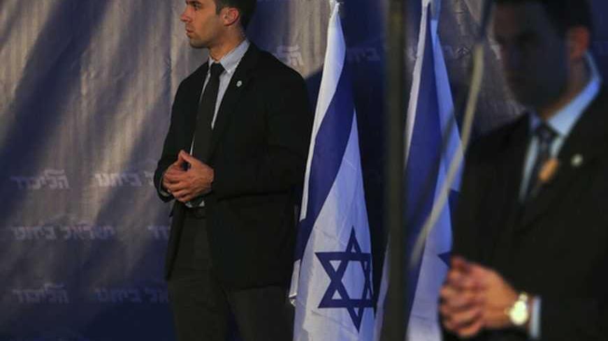 Bodyguards for Israel's Prime Minister Benjamin Netanyahu stand in position during a campaign's conference for the coming general elections in Tel Aviv January 14, 2013. Netanyahu has a simple message as he seeks a third term in office - he is a strong man and a vote for him at parliamentary elections on January 22 means Israel will be a powerful nation. REUTERS/ Nir Elias (ISRAEL - Tags: POLITICS MILITARY)