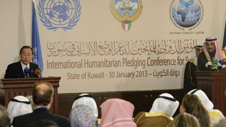 U.N. Secretary-General Ban Ki-moon and Kuwait's Foreign Minister Sheikh Sabah al Khaled al Sabah (R) hold a news conference after the first day of the "International Humanitarian Pledging Conference for Syria" in Bayan Palace, Kuwait, January 30, 2013. Donor countries have pledged more than $1.5 billion to aid Syrians stricken by civil war, Ban said on Wednesday after warning that the conflict had wrought a catastrophic humanitarian crisis. REUTERS/Stephanie McGehee (KUWAIT - Tags: POLITICS SOCIETY) - RTR3D