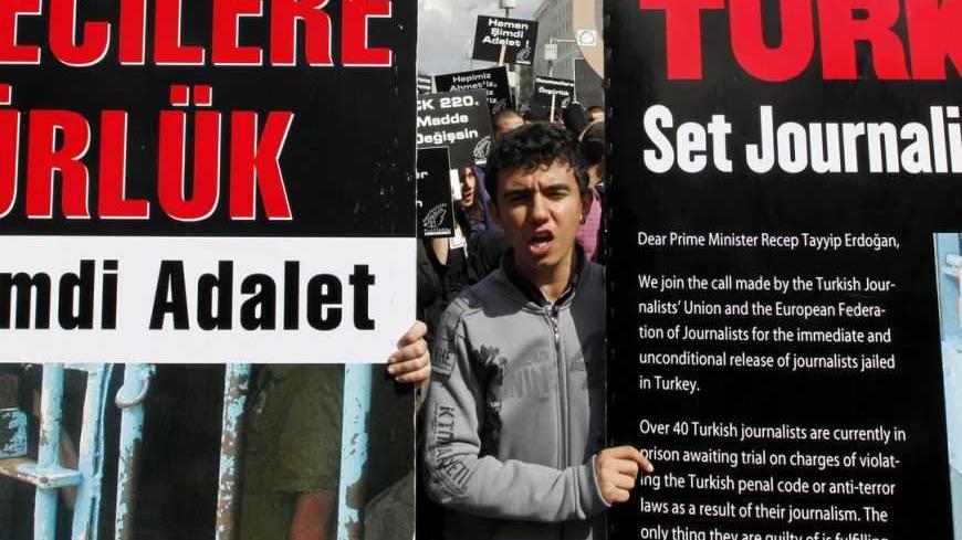 Journalists and activists participate in a rally calling for press freedom in central Ankara March 19, 2011. The recent arrest and jailing of some 10 journalists as part of investigations into Ergenekon, an ultra-nationalist, secularist network opposed to Prime Minister's Tayyip Erdogan's rule, has a triggered expressions of concern from the European Union, the U.S. and human rights groups about Ankara's commitment to media freedom and democratic principles. REUTERS/Umit Bektas (TURKEY - Tags: CIVIL UNREST 