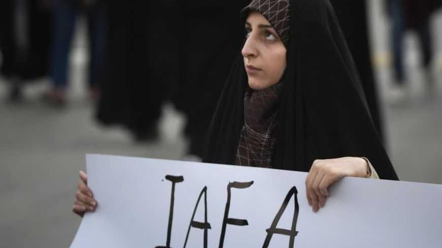 EDITORS' NOTE: Reuters and other foreign media are subject to Iranian restrictions on leaving the office to report, film or take pictures in Tehran. 
An Iranian student holds a placard as she attends a demonstration, before a ceremony to form a human chain around the Uranium Conversion Facility (UCF), to show her support for Iran's nuclear program in Isfahan, 450 km (280 miles) south of Tehran, November 15, 2011. REUTERS/Morteza Nikoubazl  (IRAN - Tags: CIVIL UNREST POLITICS EDUCATION ENERGY) - RTR2U1NL