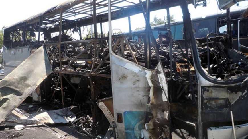A bus, that was damaged in a bomb blast on Wednesday is seen outside Burgas Airport, about 400km (248 miles) east of Sofia July 19, 2012. A suicide bomber carried out an attack that killed seven people in a bus transporting Israeli tourists in Bulgaria, the country's interior minister said on Thursday, and Israel said Iranian-backed Hezbollah militants were to blame. Video surveillance footage showed the bomber was similar in appearance to tourists arriving at the airport, Interior Minister Tsvetan Tsvetano