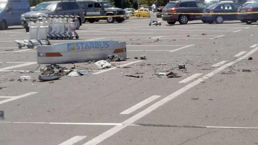 Debris from a bus that was damaged in a bomb blast on Wednesday is seen outside Burgas Airport, about 400km (248miles) east of Sofia July 19, 2012. A suicide bomber carried out an attack that killed seven people in a bus transporting Israeli tourists in Bulgaria, the country's interior minister said on Thursday, and Israel said Iranian-backed Hezbollah militants were to blame. Video surveillance footage showed the bomber was similar in appearance to tourists arriving at the airport, Interior Minister Tsveta