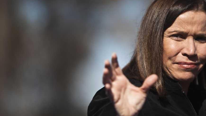 Labour party leader Shelly Yachimovich gestures during a ceremony for Tu Bishvat, the Jewish arbor day, in Ben-Shemen forest, near the Israeli town of Modiin between Tel Aviv and Jerusalem January 20, 2013. Opinion polls have shown Labour, which ruled Israel for decades but now holds only eight seats in parliament, bouncing back to second place behind Likud under new leader Yachimovich. REUTERS/ Nir Elias (ISRAEL - Tags: POLITICS ELECTIONS) - RTR3COPJ