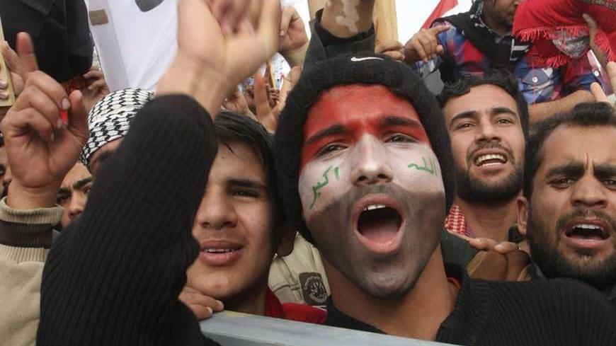 Iraqi Sunni Muslims shout slogans during an anti-government demonstration in Falluja, 50 km (30 miles) west of Baghdad, February 1, 2013. Chanting "No" to Iraqi Prime Minister Nuri al-Maliki, tens of thousands of Sunni Muslims protested after Friday prayers in huge rallies against the Shi'ite premier that are raising the spectre of renewed sectarian unrest. REUTERS/Mohanned Faisal (IRAQ - Tags: POLITICS CIVIL UNREST) - RTR3D8G9