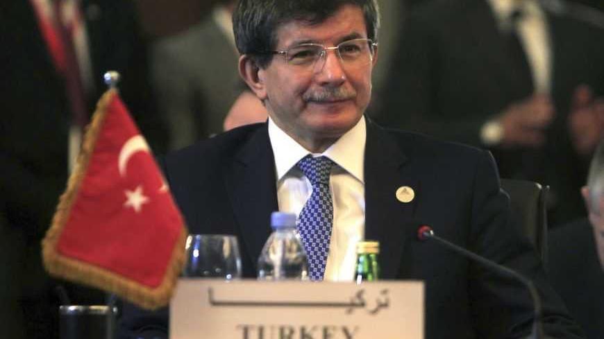 Turkish Foreign Minister Ahmet Davutoglu attends a foreign ministers meeting ahead of the Organisation of Islamic Cooperation (OIC) summit in Cairo February 4, 2013. The OIC summit will be held from February 6-7. REUTERS/Mohamed Abd El Ghany  (EGYPT - Tags: POLITICS) - RTR3DCET