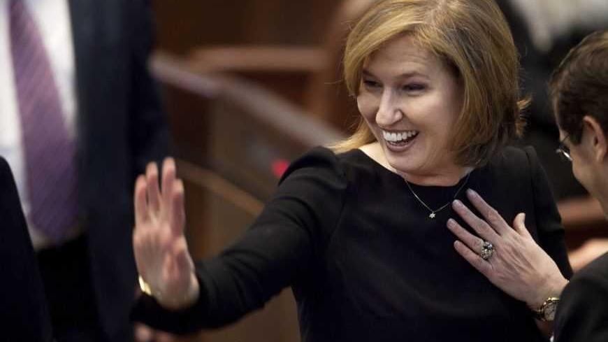 Hatnua party leader and former foreign minister Tzipi Livni gestures after the swearing-in ceremony of the 19th Knesset, the new Israeli parliament, in Jerusalem February 5, 2013.      REUTERS/Uriel Sinai/Pool (JERUSALEM - Tags: POLITICS) - RTR3DDXP
