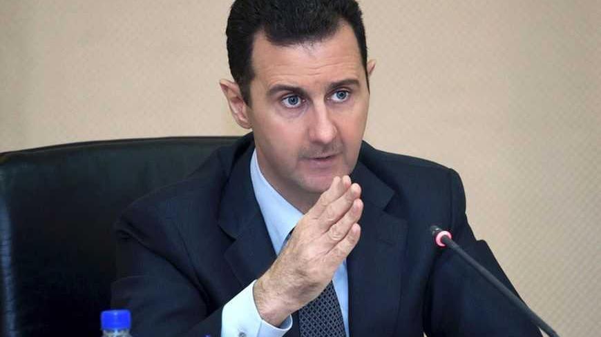 Syria's President Bashar al-Assad heads a cabinet meeting in Damascus, in this handout photograph distributed by Syria's national news agency SANA on February 12, 2013. REUTERS/SANA/Handout (SYRIA - Tags: POLITICS CONFLICT CIVIL UNREST) ATTENTION EDITORS - THIS IMAGE WAS PROVIDED BY A THIRD PARTY. FOR EDITORIAL USE ONLY. NOT FOR SALE FOR MARKETING OR
ADVERTISING CAMPAIGNS. THIS IMAGE HAS BEEN SUPPLIED BY A THIRD PARTY. IT IS DISTRIBUTED, EXACTLY AS RECEIVED BY REUTERS, AS A SERVICE TO CLIENTS - RTR3DOUK