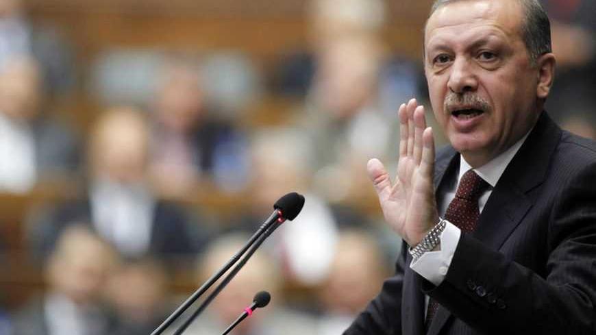 Turkey's Prime Minister Tayyip Erdogan addresses members of parliament from his ruling AK Party during a meeting at the Turkish parliament in Ankara April 19, 2010. REUTERS/Umit Bektas (TURKEY - Tags: POLITICS) - RTR2D060