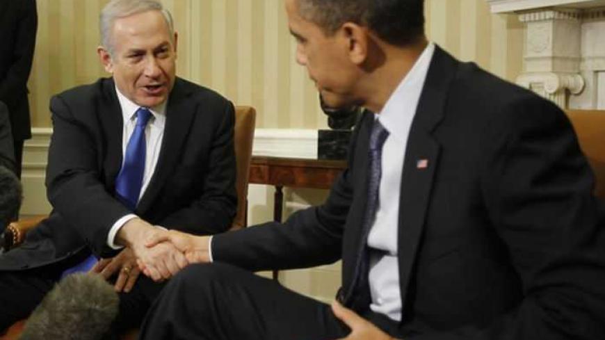 U.S. President Barack Obama (right) shakes hands with Israel's Prime Minister Benjamin Netanyahu during their meeting in the Oval Office of the White House in Washington, March 5, 2012. REUTERS/Jason Reed (UNITED STATES - Tags: POLITICS) - RTR2YVLP