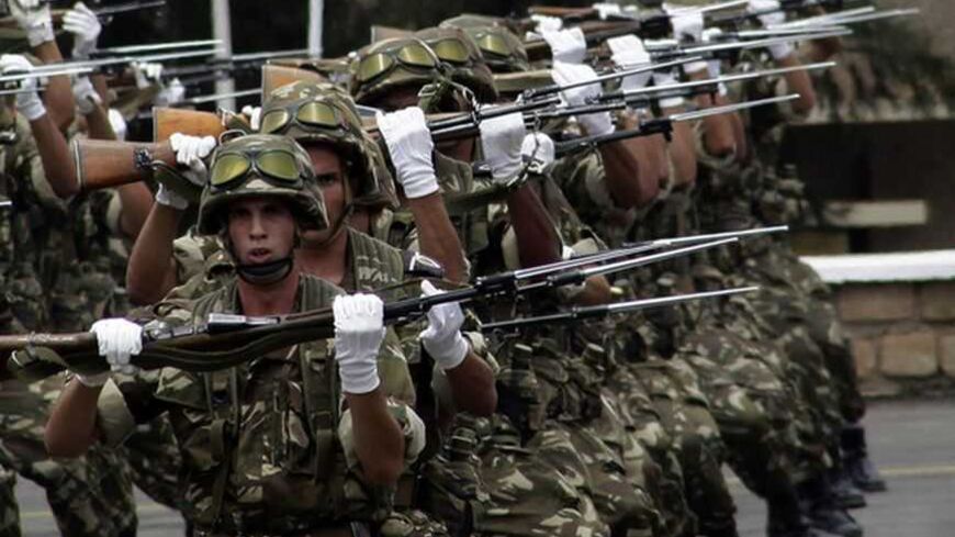 Trainees army officers from the 40th class march during their graduation ceremony at a Military Academy in Cherchell 90 km west of Algiers June 27, 2012. REUTERS/Ramzi Boudina (ALGERIA - Tags: MILITARY) - RTR348KJ
