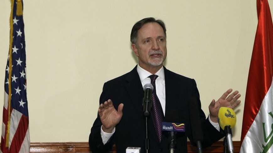 U.S. Ambassador to Iraq Robert Stephen Beecroft speaks in between cutouts of U.S. President Barack Obama and Republican presidential candidate Mitt Romney (R) during a news conference in Baghdad, after the announcement of Obama's victory in the U.S. presidential election November 7, 2012.  REUTERS/Khalid Mohammed/Pool   (IRAQ - Tags: POLITICS ELECTIONS USA PRESIDENTIAL ELECTION) - RTR3A3ZX