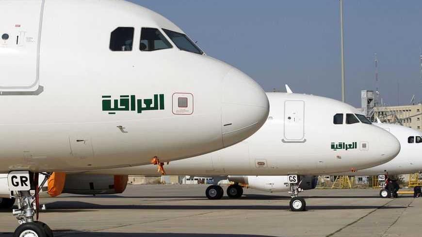 Boeing 777 jets are seen on the tarmac at Baghdad international airport December 15, 2012. Three Boeing twin-aisle 777-200LR jets arrived in Baghdad in a move aimed to boost the transportation sector in a country suffering decades of wars and sanctions. REUTERS/Mohammed Ameen (IRAQ - Tags: POLITICS TRANSPORT BUSINESS) - RTR3BLRU
