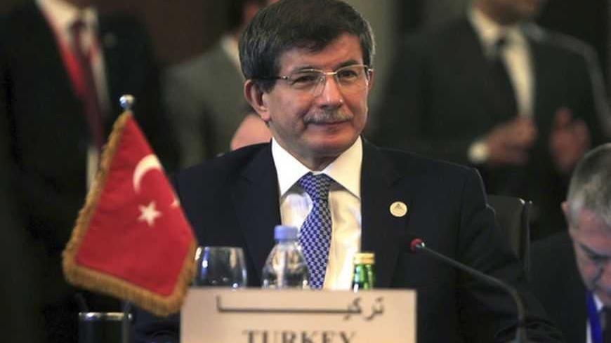 Turkish Foreign Minister Ahmet Davutoglu attends a foreign ministers meeting ahead of the Organisation of Islamic Cooperation (OIC) summit in Cairo February 4, 2013. The OIC summit will be held from February 6-7. REUTERS/Mohamed Abd El Ghany (EGYPT - Tags: POLITICS) - RTR3DCET