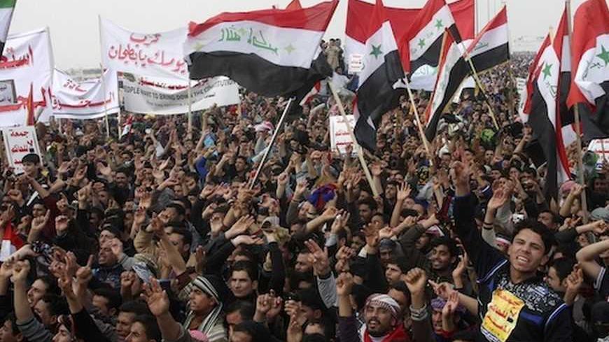 Iraqi Sunni Muslims take part in an anti-government demonstration in Falluja, 50 km (31 miles) west of Baghdad, February 8, 2013. Tens of thousands of Sunni Muslims protested after Friday prayers in huge rallies against Shi'ite Iraqi Prime Minister Nuri al-Maliki, demanding that he step down. REUTERS/Mohanned Faisal (IRAQ - Tags: POLITICS CIVIL UNREST RELIGION) - RTR3DHVK