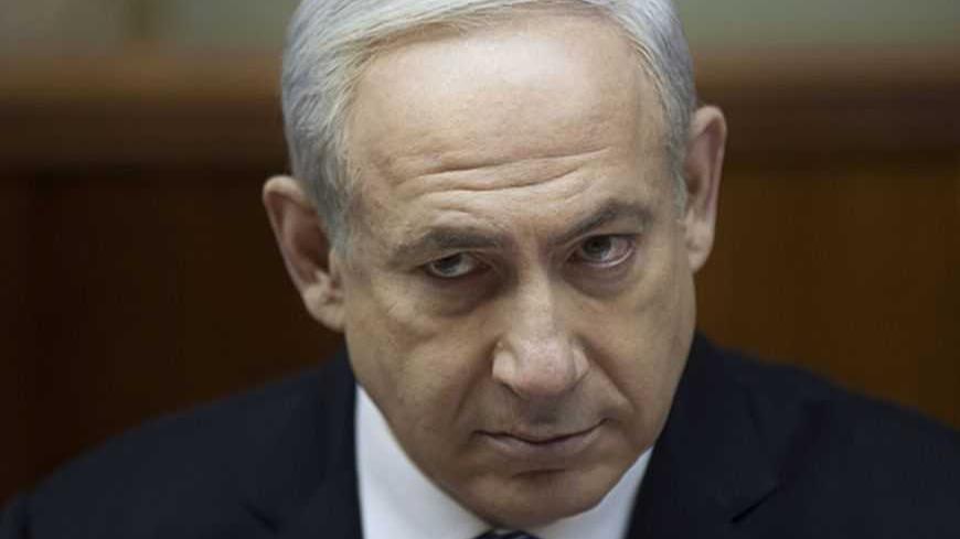 Israel's Prime Minister Benjamin Netanyahu attends the weekly cabinet meeting in Jerusalem February 10, 2013. Iran's nuclear ambitions, the civil war in Syria and stalled Israeli-Palestinian peace efforts will top the agenda of U.S. President Barack Obama's visit to Israel, Netanyahu said on Sunday. REUTERS/Uriel Sinai/Pool (JERUSALEM - Tags: POLITICS HEADSHOT TPX IMAGES OF THE DAY) - RTR3DKNM