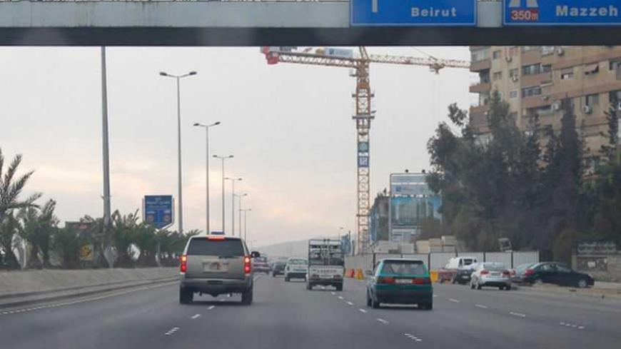 The car of U.S. ambassador to Syria Robert Ford (L) travels on the Damascus airport highway January 16, 2011. Ford arrived in Damascus on Sunday to take up his post after more than a five-year break in top U.S. diplomatic representation in Syria. REUTERS/Khaled al-Hariri   (SYRIA - Tags: POLITICS) - RTXWMYK
