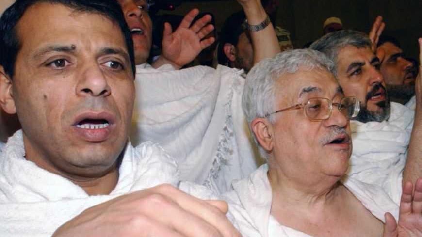 (L-R) Fatah leadership member Mohammed Dahlan, Palestinian President Mahmoud Abbas, and Hamas leader Khaled Meshaal pray at the Grand Mosque in Mecca early February 9, 2007, in this handout photo by the Palestinian Authority Press Office. REUTERS/Omar Rashidi/Handout (SAUDI ARABIA) - RTR1M6EV