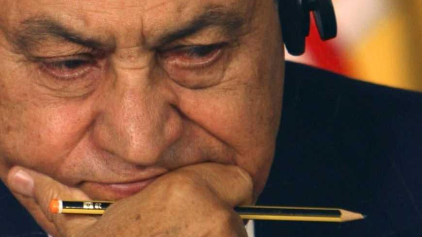 Egyptian President Hosni Mubarak reacts during a news conference in Sharm el-Sheikh January 18, 2009. The leaders of Britain, the Czech Republic, Egypt, France, Germany, Jordan, Spain and Turkey, along with U.N. Secretary-General Ban Ki-moon, are meeting in the resort of Sharm el-Sheikh to coordinate policy on the Israeli-Palestinian conflict after three weeks of fighting in and around Gaza. REUTERS/Amr Dalsh (EGYPT) - RTR23JNE