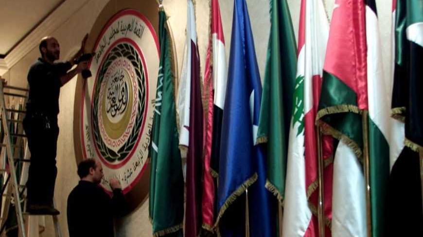 Lebanese workers fix the symbolic of the Arab League and flags at the
main conference hall at the Phoenicia hotel in Beirut March 22, 2002.
Syria is poised to jump on the bandwagon of the Saudi Middle East peace
proposal at next week's Arab League summit in Beirut. REUTERS/ Jamal
Saidi

js/ - RTR2TS6